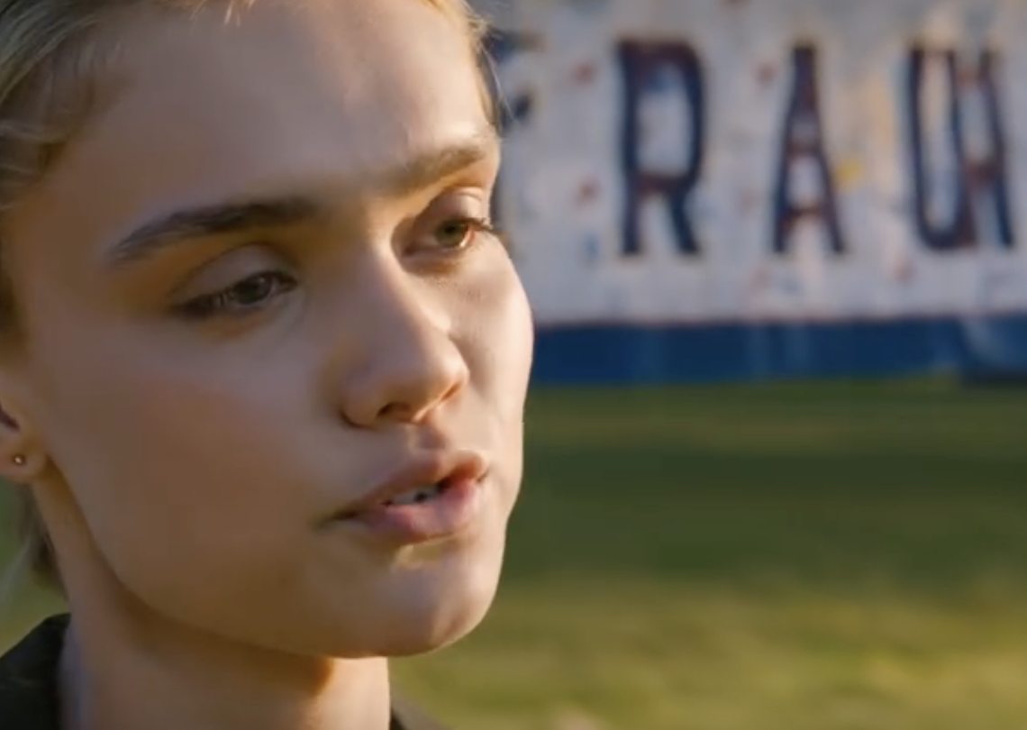 At my graduation party in a suburban backyard, my mom tapped her glass with a bright smile and announced to everyone: “Time for the truth, we adopted her to make money off her.” My sister snickered, my dad just leaned back smirking. I stood up calmly, pulled a sealed envelope from my jacket. I didn’t cry. I opened the papers, read exactly one passage, and the whole crowded party suddenly went dead silent.